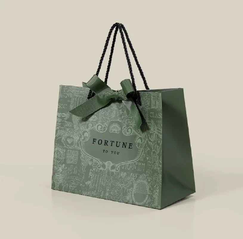 500pcs Wholesale Custom Logo Design Paper Bags | Luxury Ribbon Handle Gift Packaging for Cosmetics & Jewelry | High-Quality 250g Paperboard Shopping Bags Luxegan
