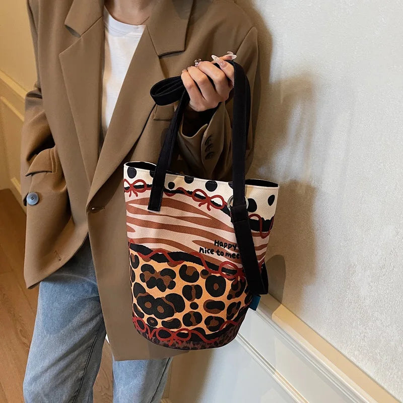 Trendy Leopard Print Illustration Splicing Bucket Bag | New Large-Capacity Canvas Shoulder Handbag for Women Luxegan