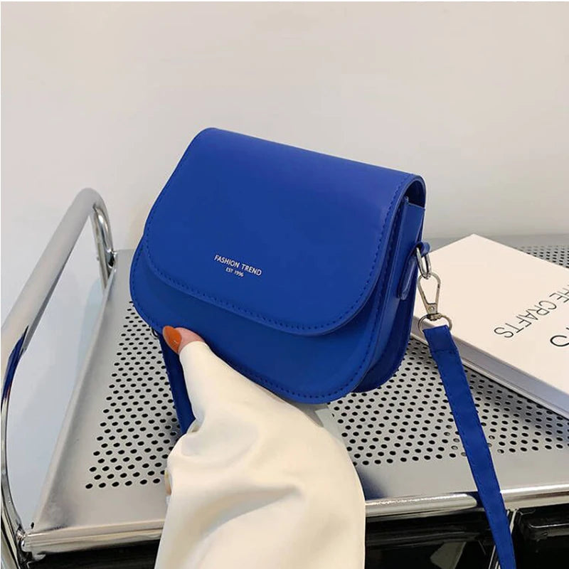 Trendy Saddle Shoulder Bag for Women | Sophisticated PU Leather Crossbody | Simple Solid Color Flap Messenger Bag | Fashion-Forward Designer Pouch for Versatile Daily Matching Luxegan