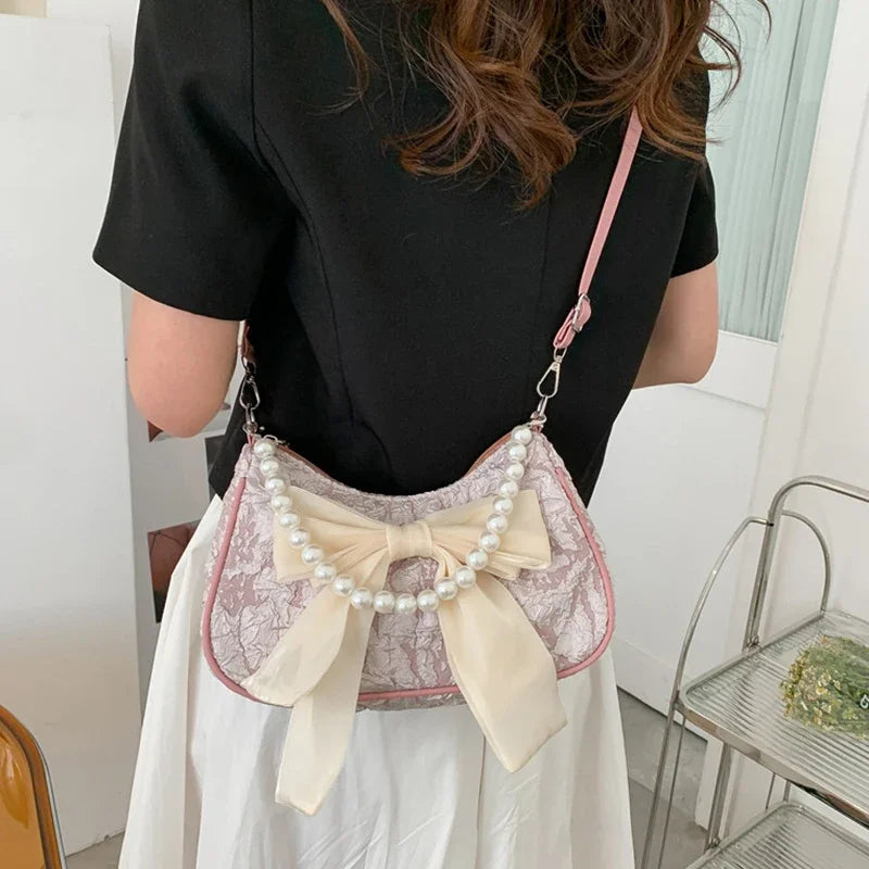 White Folds Pop Retro Bow Bag | Female Pearl Handle New Fashion Pearl Armpit Shoulder & Crossbody Bag Luxegan