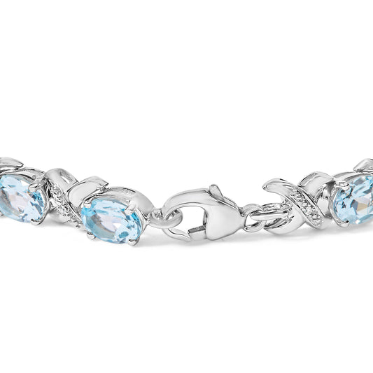 Pulsera de eslabones X tipo tenis de plata de ley .925 con topacio azul ovalado y acentos de diamantes de 16.0 Cttw (color I-J, claridad I1-I2) - Tamaño 7 pulgadas