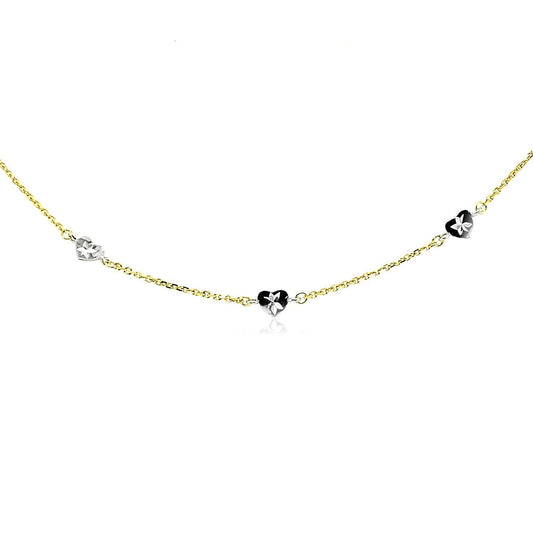 Tobillera de oro de 14k de dos tonos con estaciones de corazón de estilo tallado con diamante
