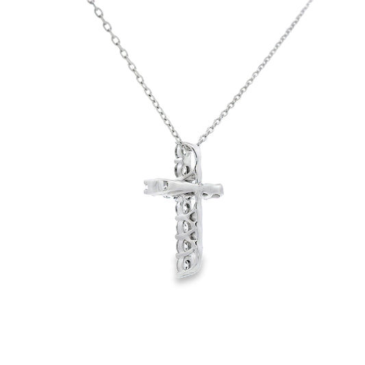 Colgante religioso de cruz con diamante de .35ct en oro blanco de 14K