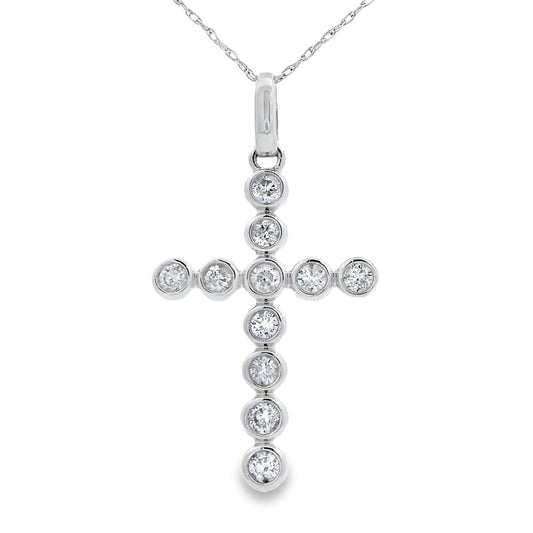 Colgante religioso de cruz con diamante de .50ct, oro blanco de 14KT
