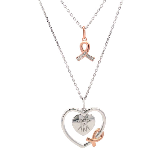 Colgante de corazón de diamantes de .02 ct y plata esterlina