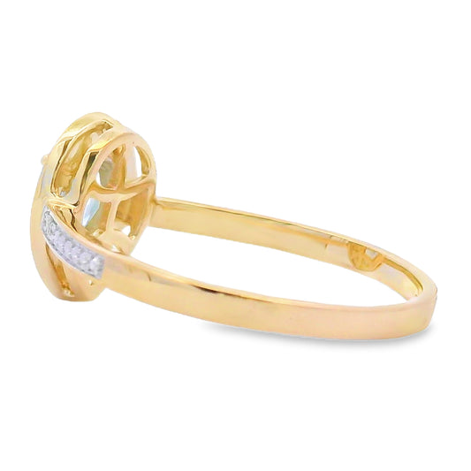 Anillo de aguamarina y diamantes de .39 ct en oro amarillo de 10 kt