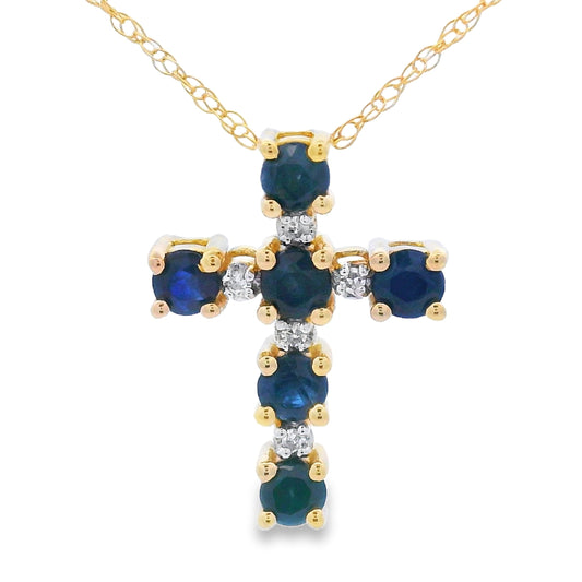 Colgante religioso de cruz con zafiros de .32ct en oro amarillo de 10K