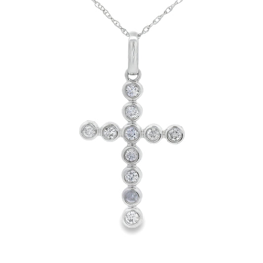 Colgante religioso de cruz con diamante de .31 ct en oro blanco de 14 kt