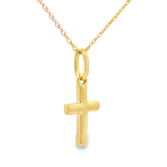 Colgante religioso de cruz con diamante de .04 ct en oro amarillo de 10 kt