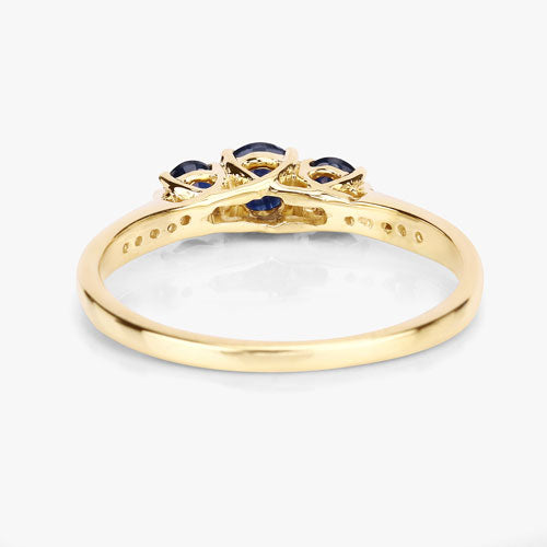 Anillo de oro amarillo de 14K con zafiro azul genuino de 0,56 quilates y diamantes blancos