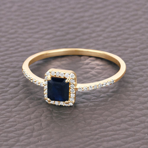 Anillo de oro amarillo de 14K con zafiro azul genuino de 0.60 quilates y diamantes blancos