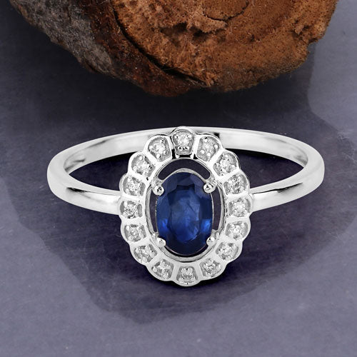 Anillo de oro blanco de 14K con zafiro azul genuino de 0,52 quilates y diamantes blancos